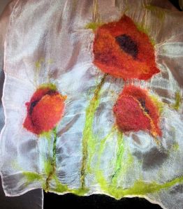 Hemmed silk scarf showeing 3 poppies nuno felted at one end